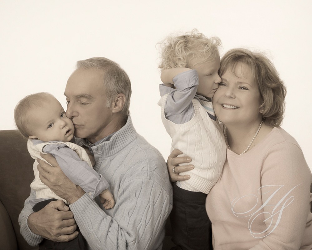 A family of four posing for the camera.