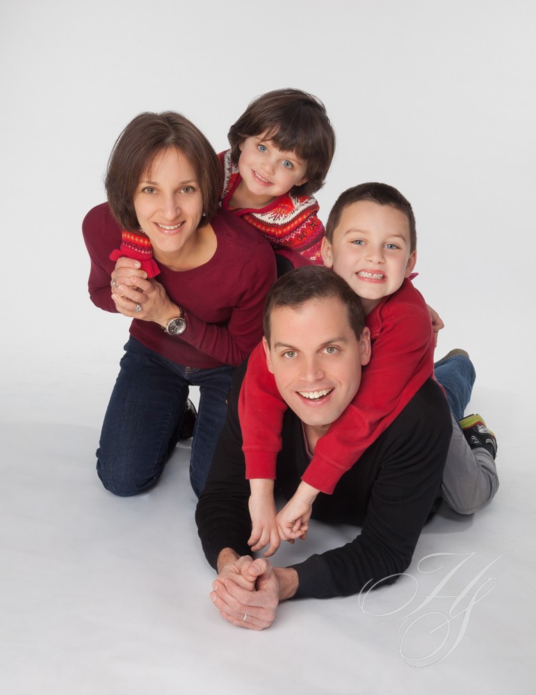 A family of four posing for a picture.