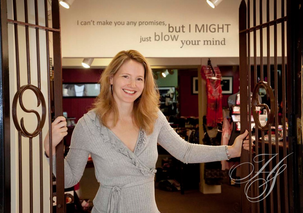 A woman standing in front of a mirror.