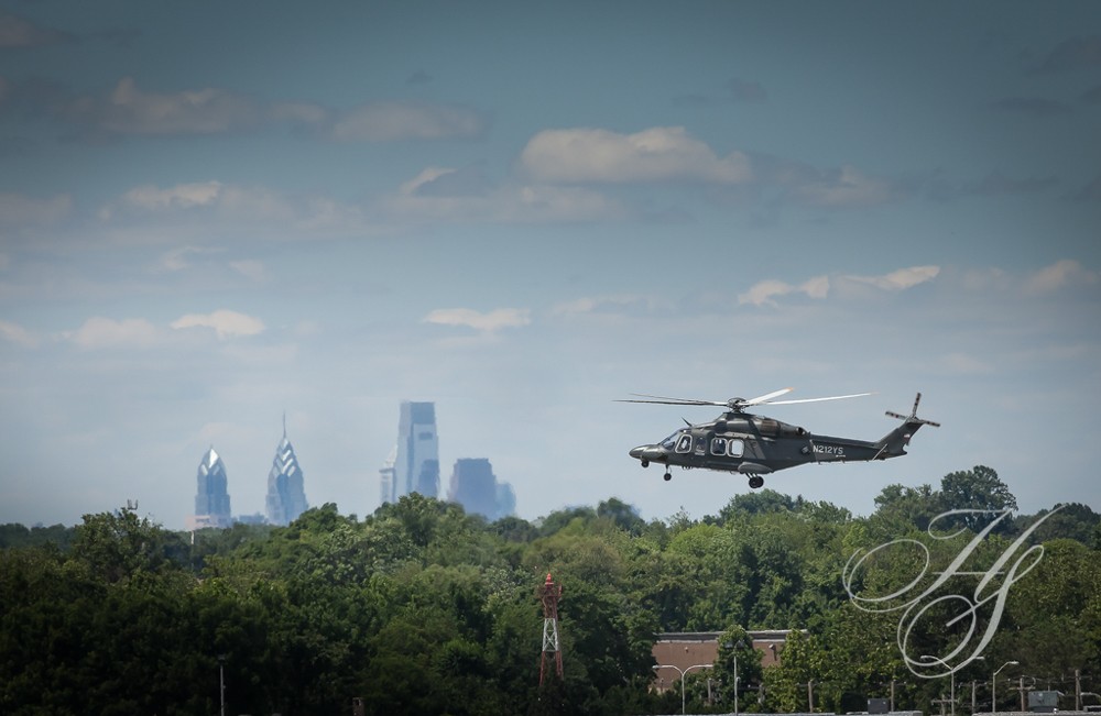 A helicopter flying over the city of philadelphia.