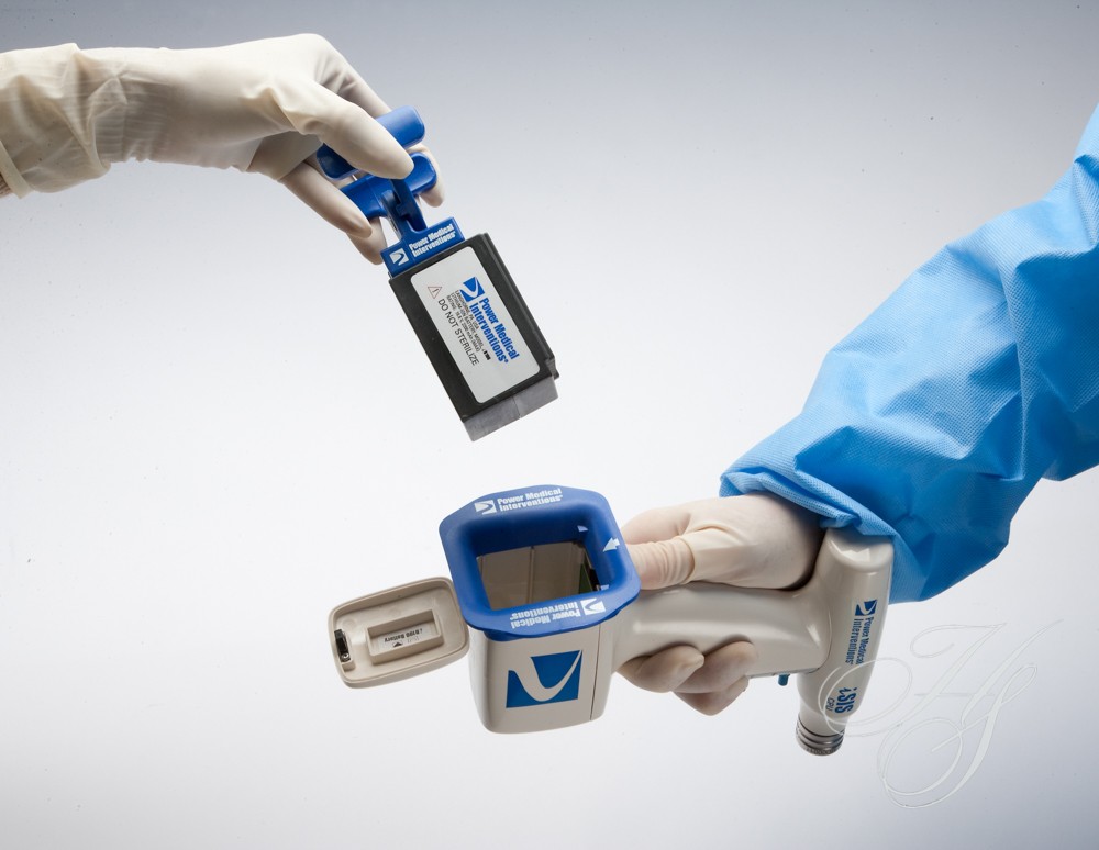 A person holding two electronic devices in their hands.