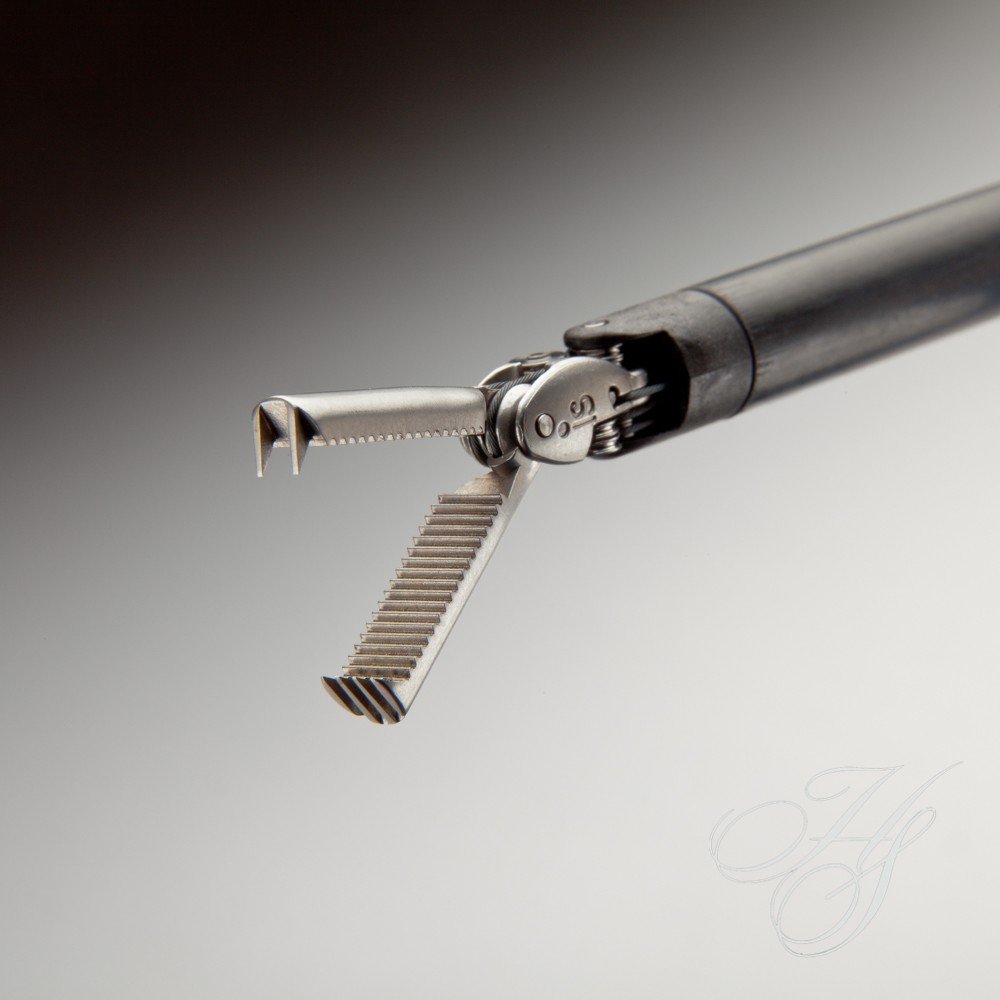 A close up of the blade and handle on an electric toothbrush.