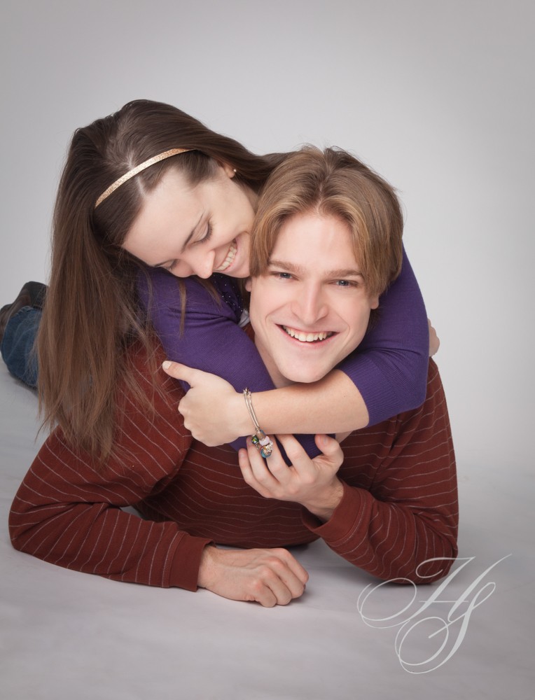A man and woman are laying on the ground