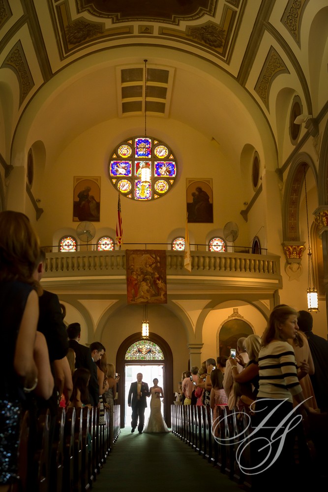 A group of people standing in front of a church.