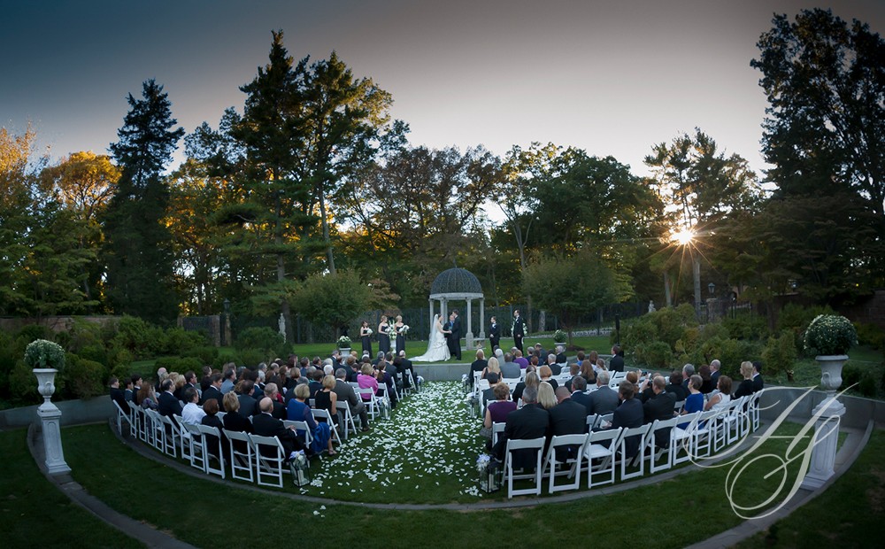 A wedding ceremony in the middle of an outdoor setting.