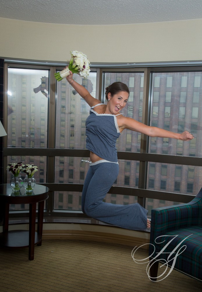 A woman jumping in the air with flowers
