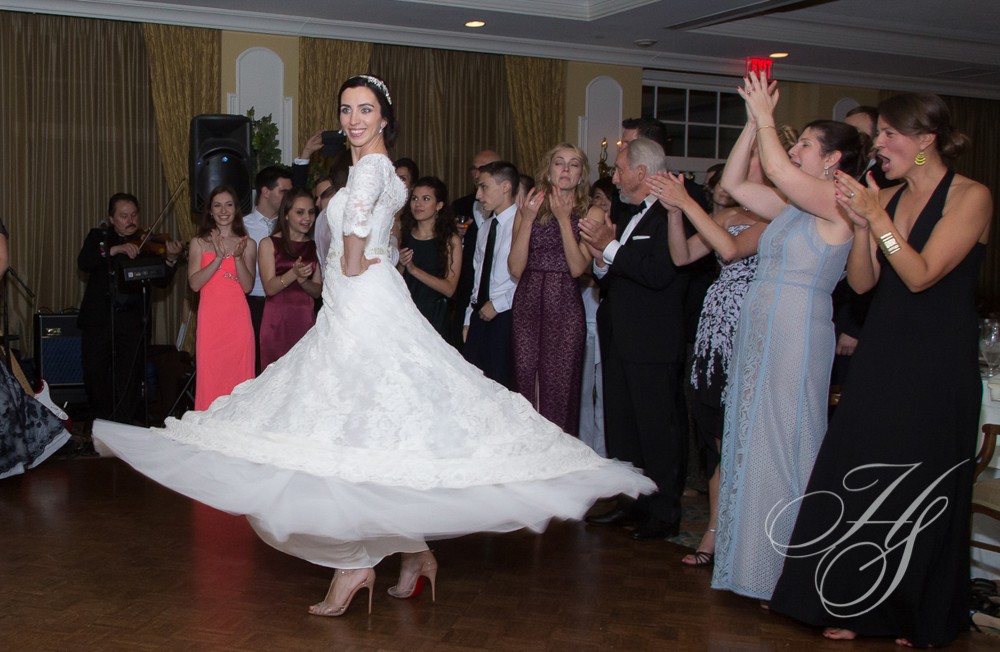 A woman in a white dress is dancing
