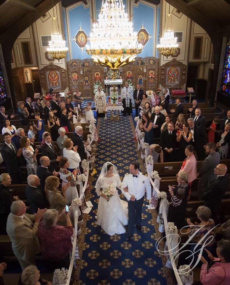 A wedding ceremony in an old church with many people.