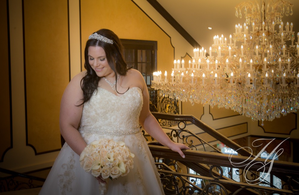 A bride standing on the stairs of her wedding.