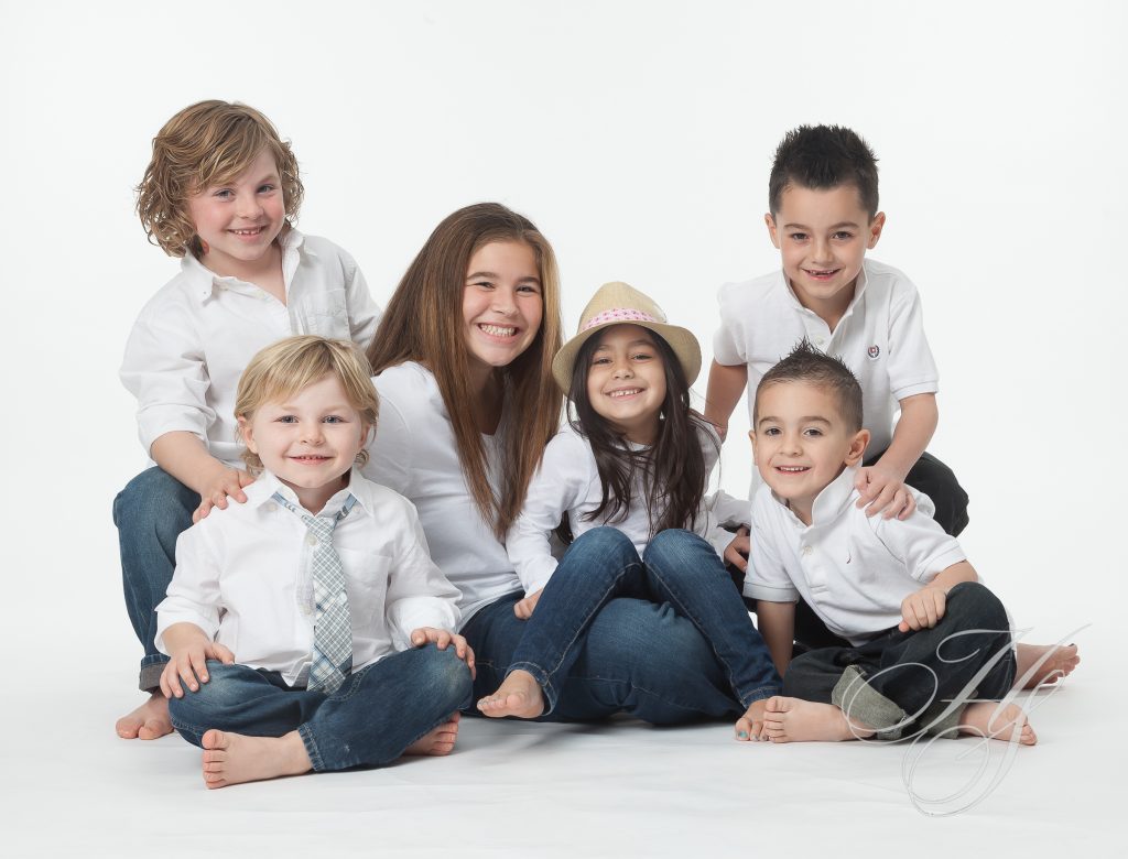 A group of children sitting on the ground