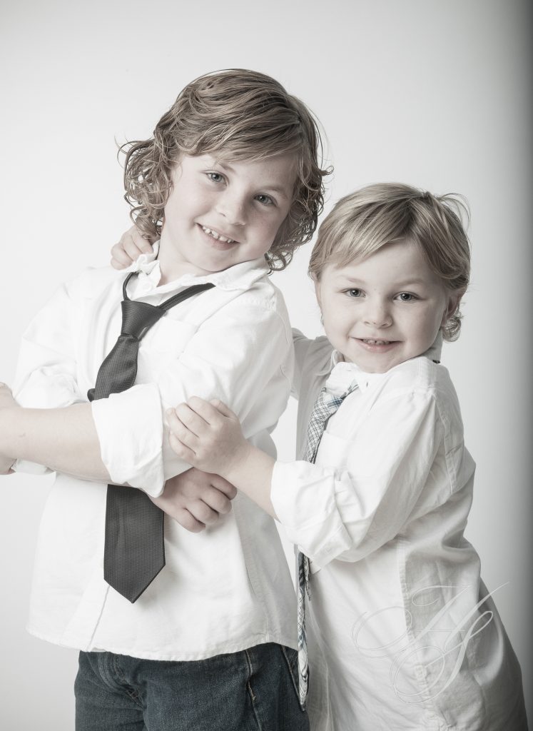 Two young children posing for a picture.