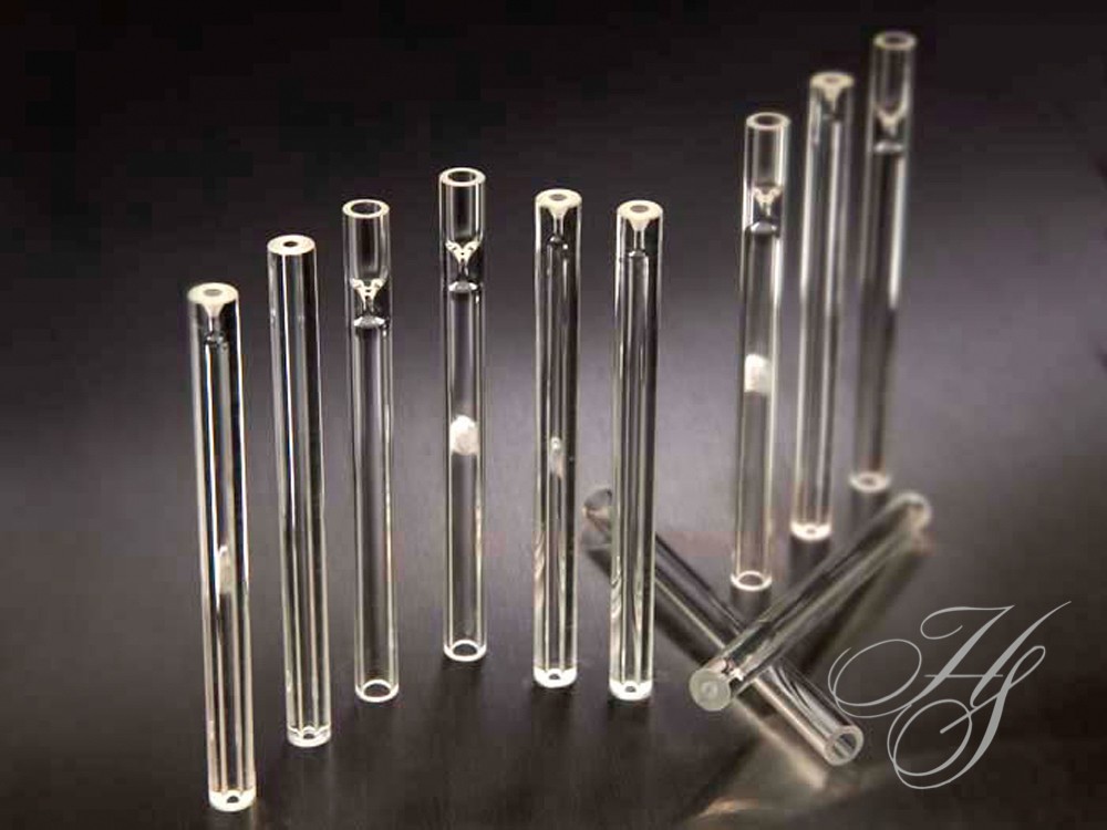 A group of glass tubes sitting on top of a table.