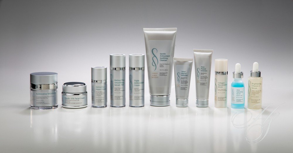 A group of skin care products sitting on top of a table.