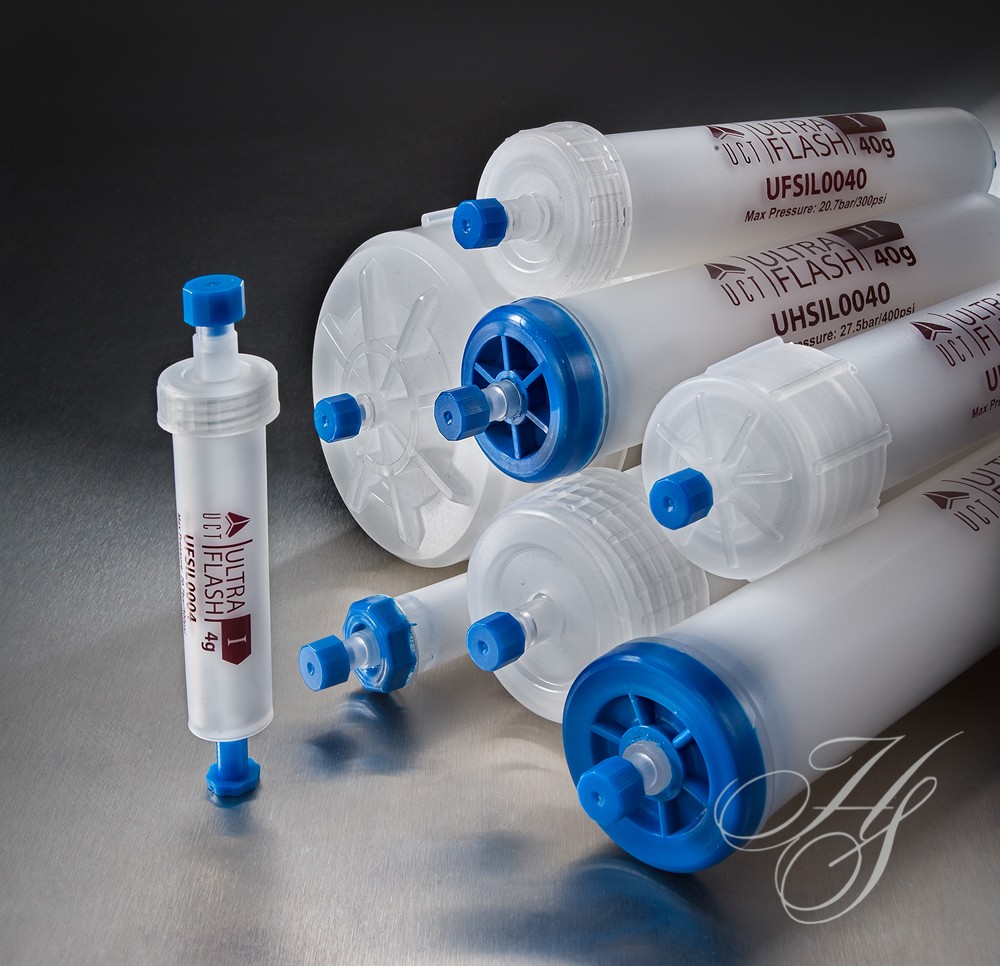A group of tubes with blue caps and white labels.