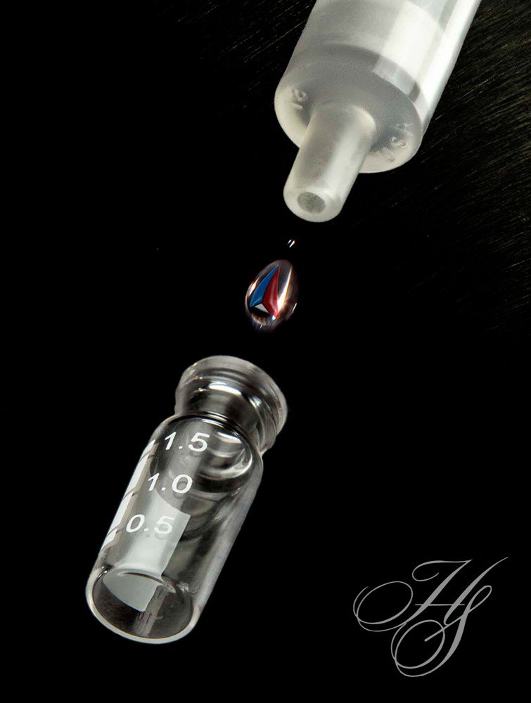 A glass bottle with liquid inside of it