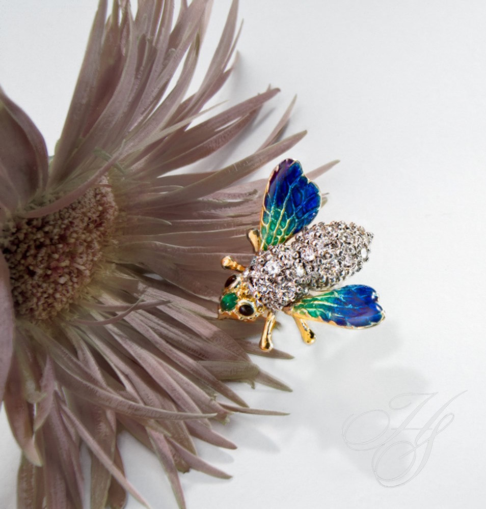 A close up of a bee on top of a flower