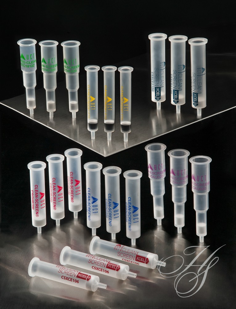 A group of different types of syringes on top of each other.