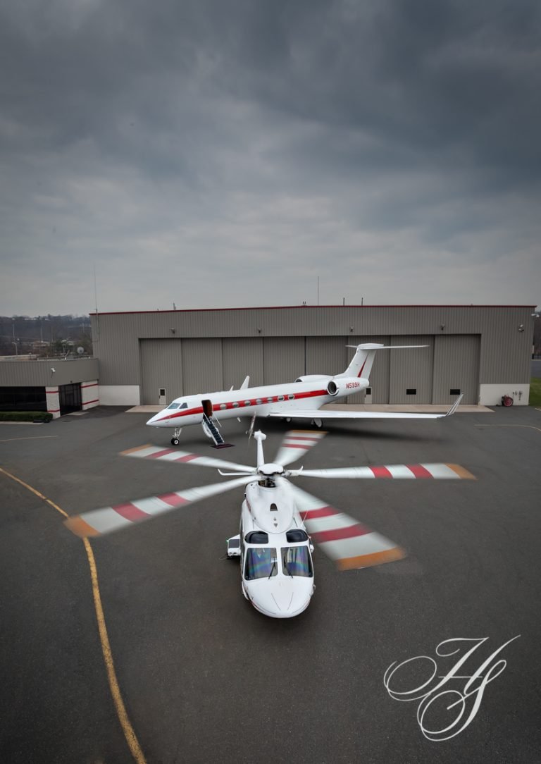 A helicopter sitting on top of an airport runway.