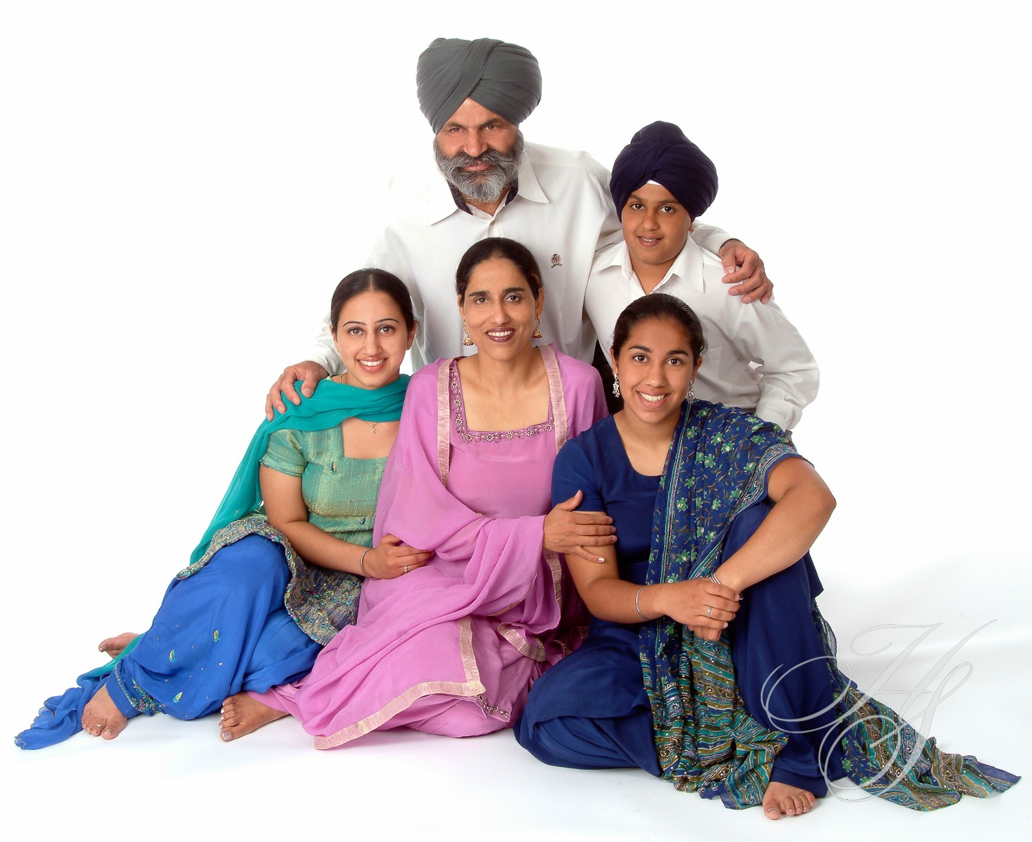 A family posing for the camera in their clothes.