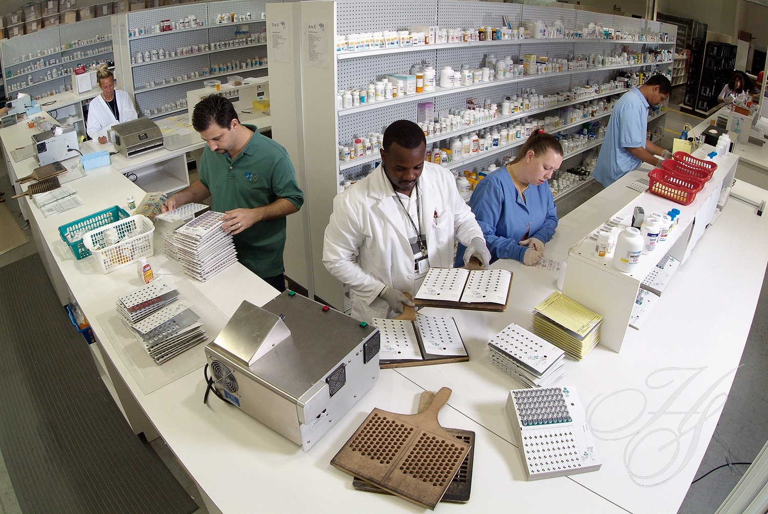 A group of pharmacists working in a pharmacy.