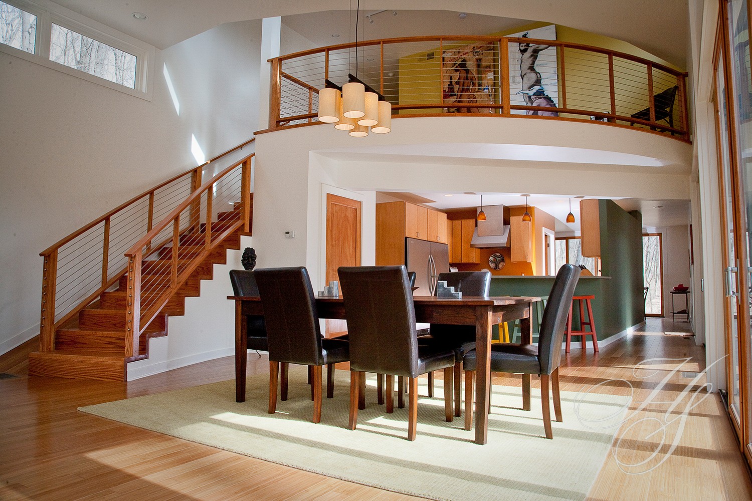 A dining room with a table and chairs in it