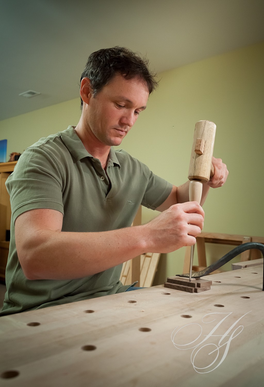 A man is working on something with wood.