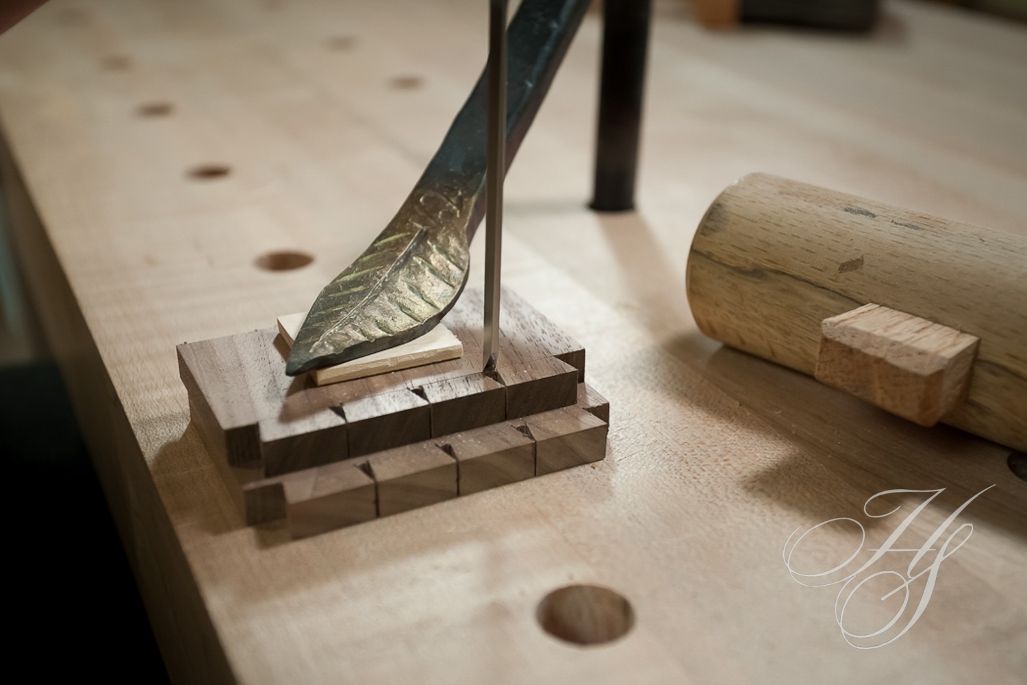 A wooden table with a pen and ink on it