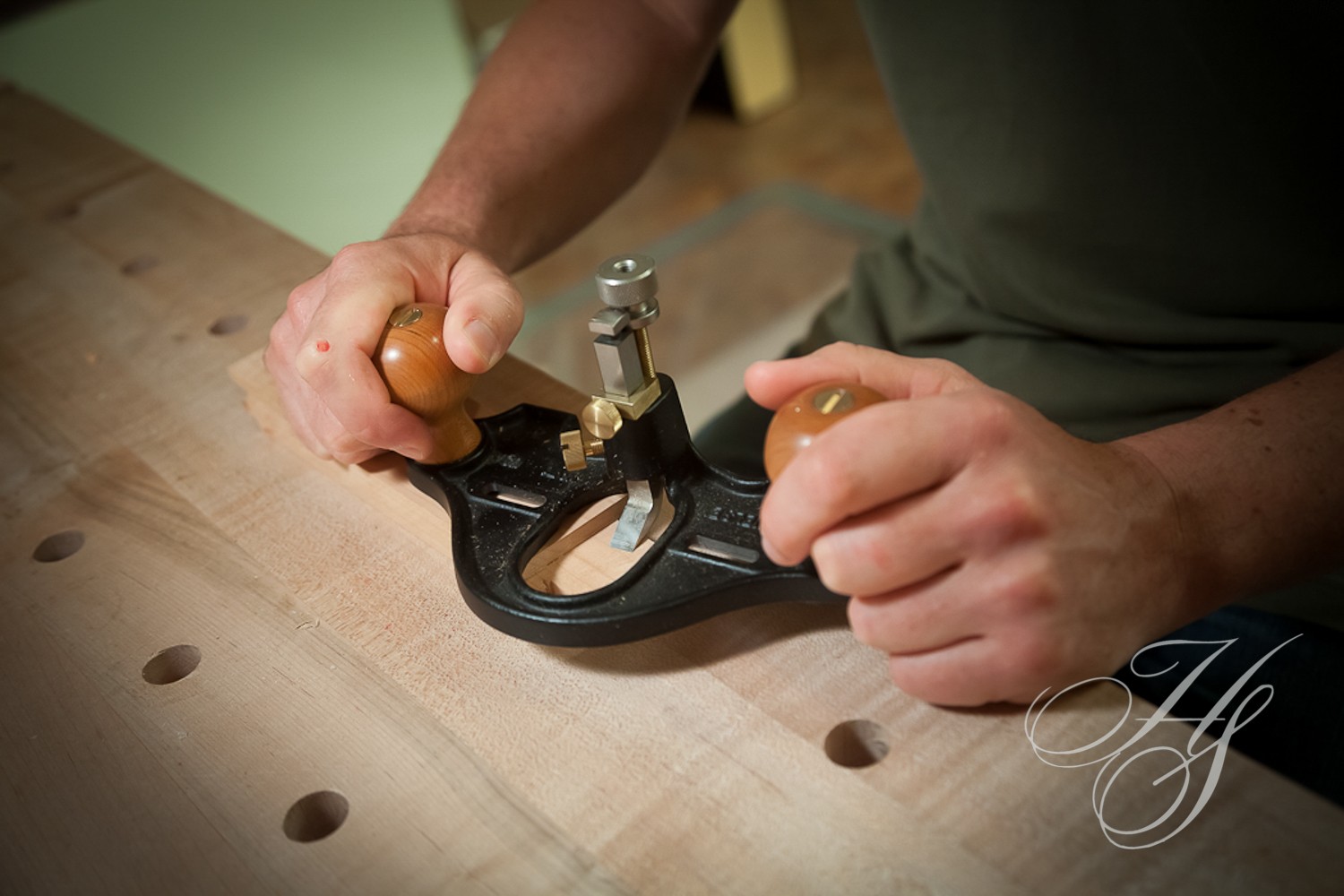 A person using a pair of hand tools to make something.