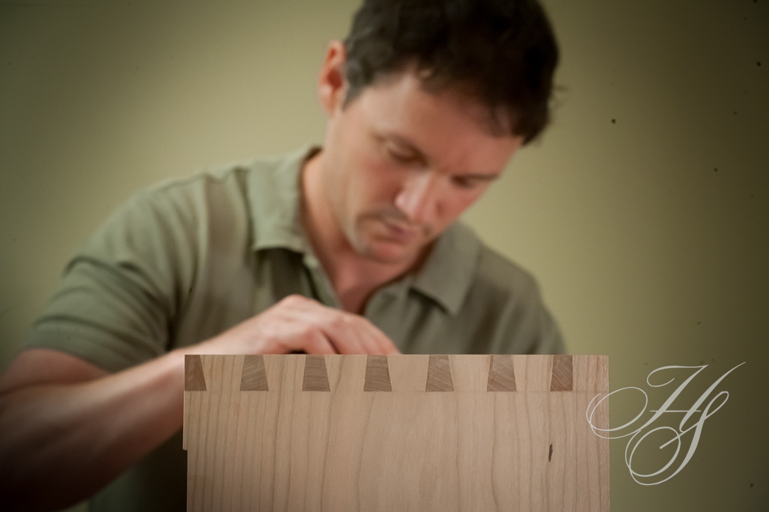A man is working on something with wood.
