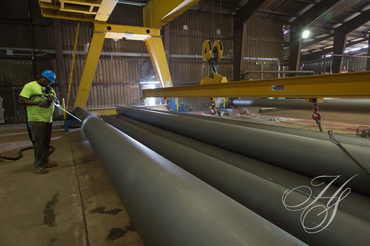 A large pipe sitting in the middle of an assembly line.