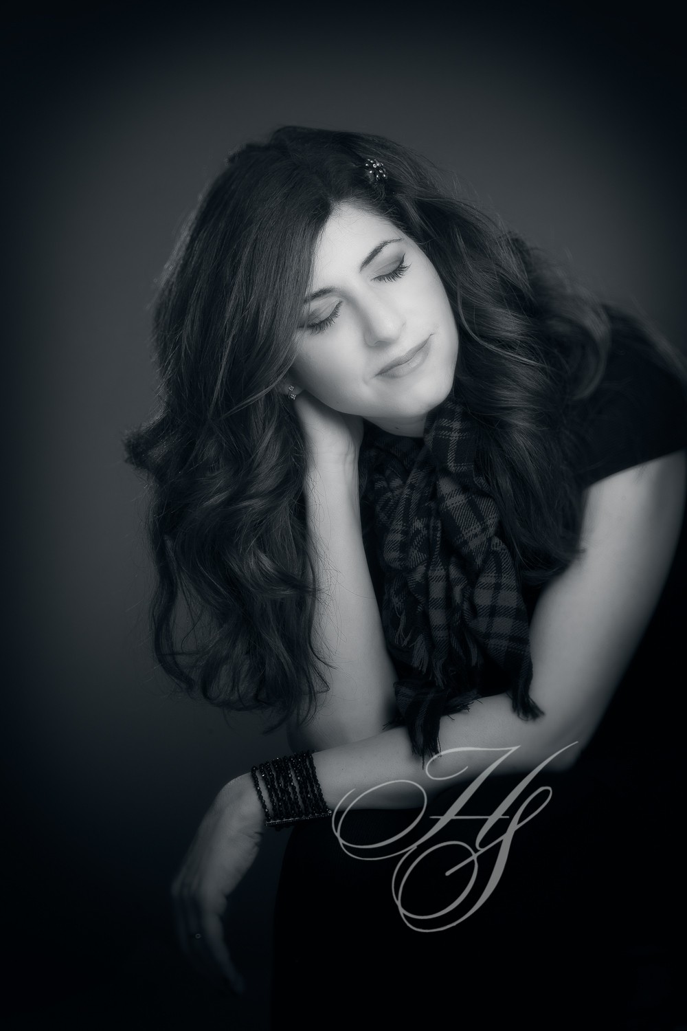 A woman with long hair and a black shirt