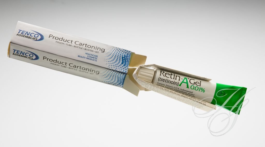A tube of toothpaste is next to the packaging.