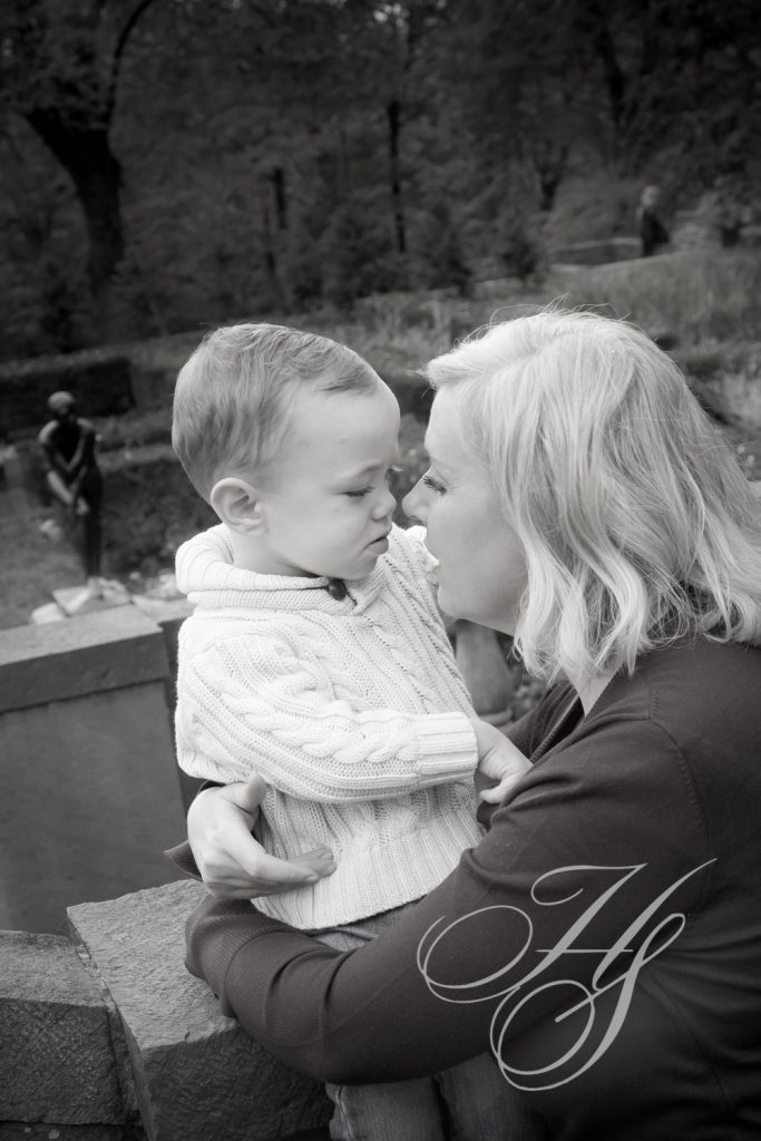 A woman holding a baby in her arms.