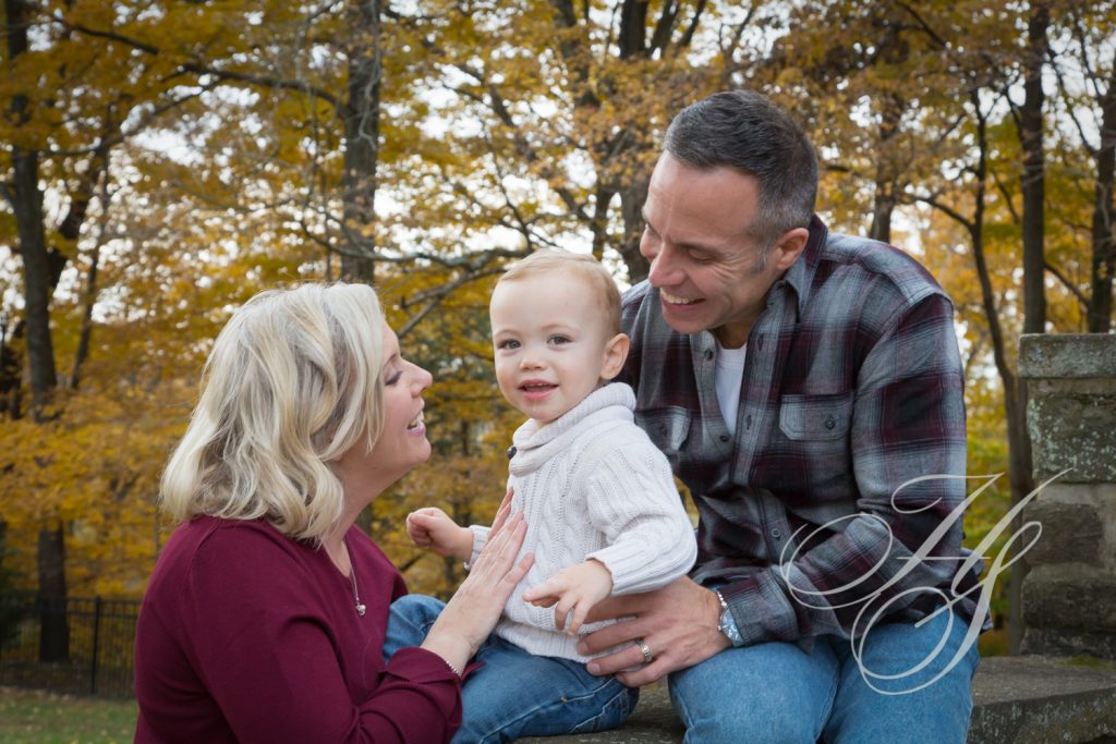 A man and woman holding a baby boy.