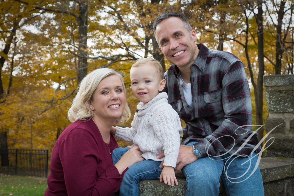 A man and woman holding a baby boy.