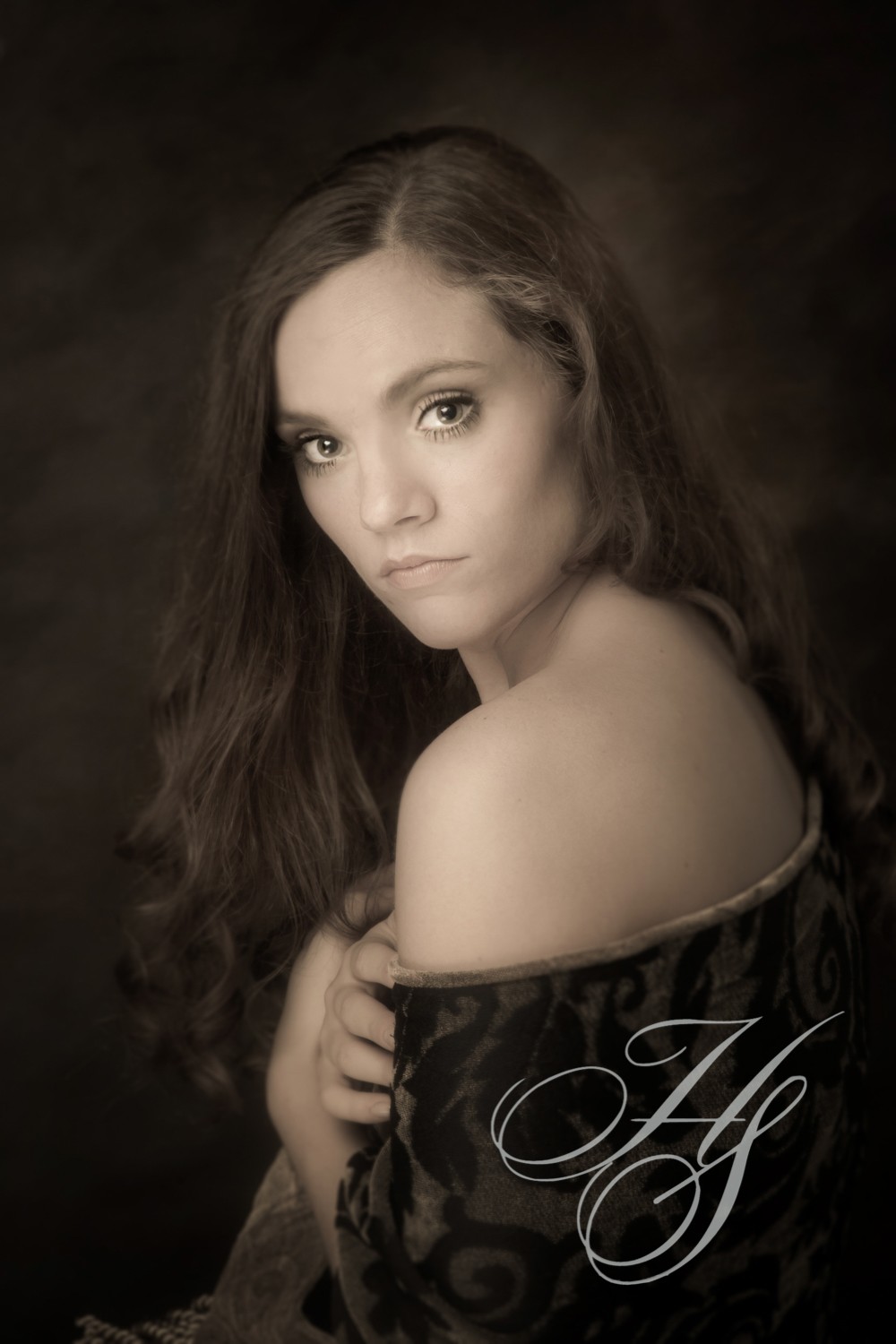 A woman with long hair posing for a photo.