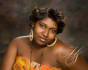 A woman with short hair and a yellow dress.