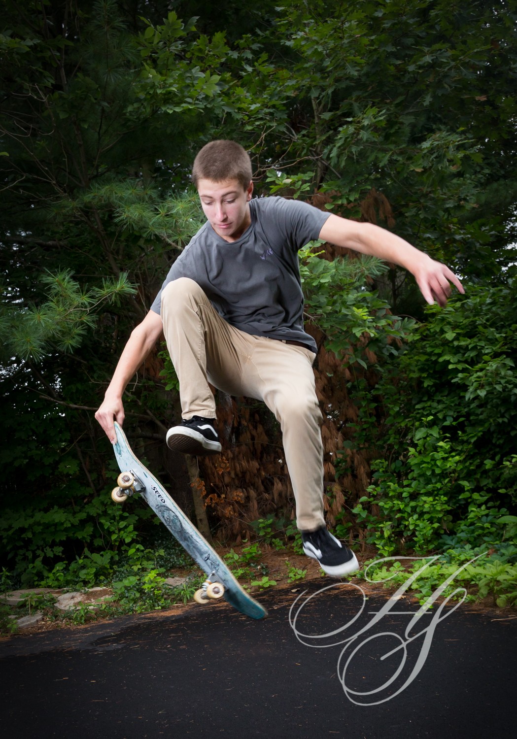 A man doing tricks on his skateboard in the air.