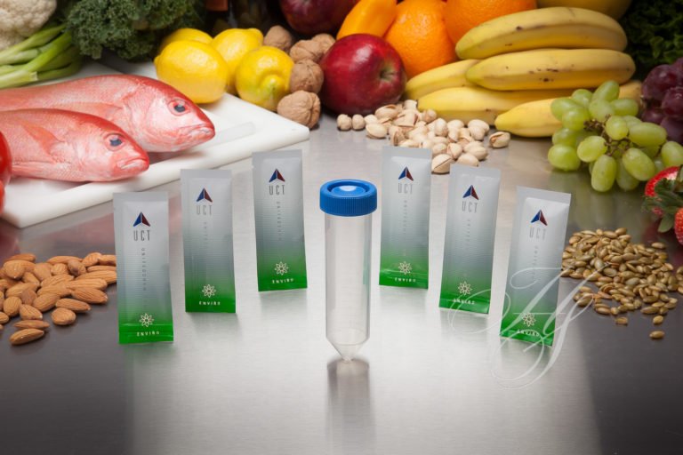 A group of seven juice boxes sitting on top of a table.
