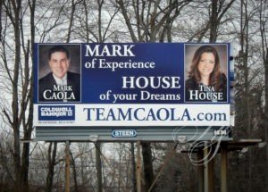 A billboard with two people on it