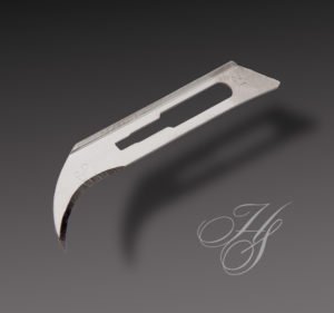 A close up of a knife with the letter h on it